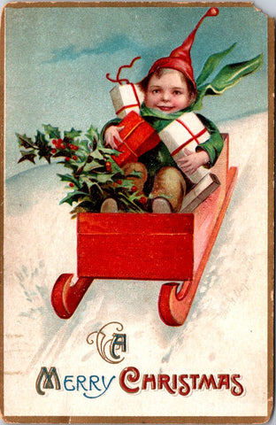 Xmas - A Merry Christmas - boy in wooden sleigh with presents - Ellen Clapsaddle