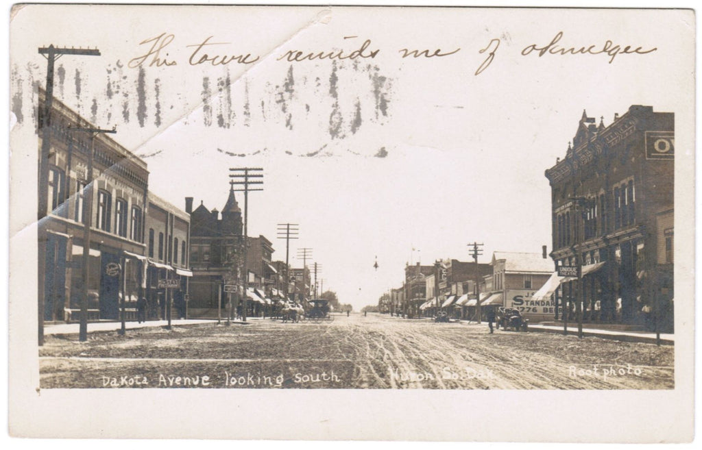 SD, Huron - Dakota Ave with signs - Root RPPC postcard - F09054