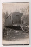 Train - Railroad - stationary cars on hand hewn RR Ties, Man - RPPC - E17042