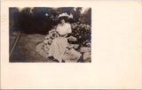 People - Female postcard - Woman, large hat posing on RPPC - 2k1295