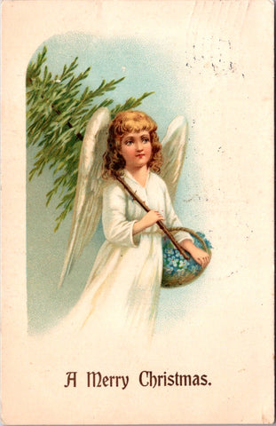 Xmas - Angel with wings holding basket and Christmas tree in hand postcard