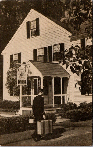 MA, Sturbridge - Publick House, man carrying suitcase postcard - B11372