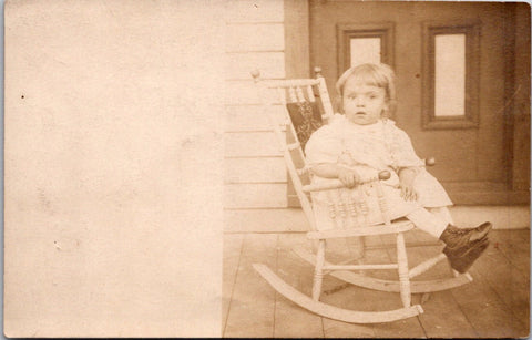 People - Child - in small rocking chair on a porch @1909 RPPC - B17227