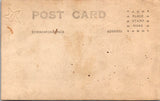 Military Man in uniform - posing with arm on table - RPPC -  B17231