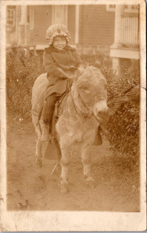 People - Child - sitting on a small donkey RPPC - B17232