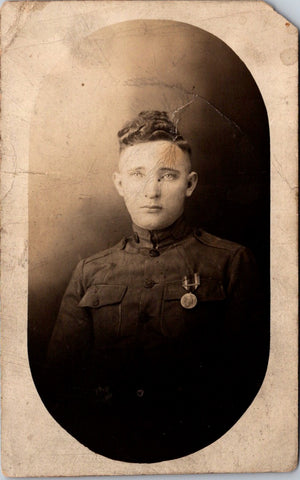 Military Man in uniform - has a medal on his breast pocket - RPPC -  B172