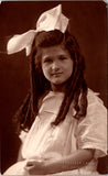 People - Girl - large white dress, bow with FANTASTIC ringlets RPPC - BP0047