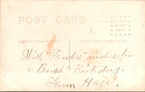 People - Girl - posing while wearing a big bow in her curly hair RPPC - C08355