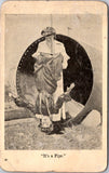 People - Female postcard - Young women, one upside down in pipe - E23042