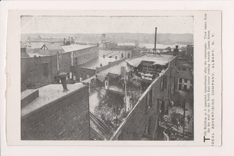 NY, Albany - fire aftermath - W M Whitney sign next door - postcard - E23043