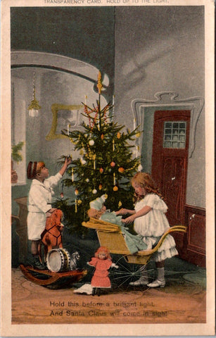 Xmas -  Transparency Card - kids, christmas tree, toys - Santa Claus appears Hold to Light postcard