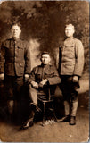 Military Men in uniform - one seated, 2 standing - RPPC - E23235