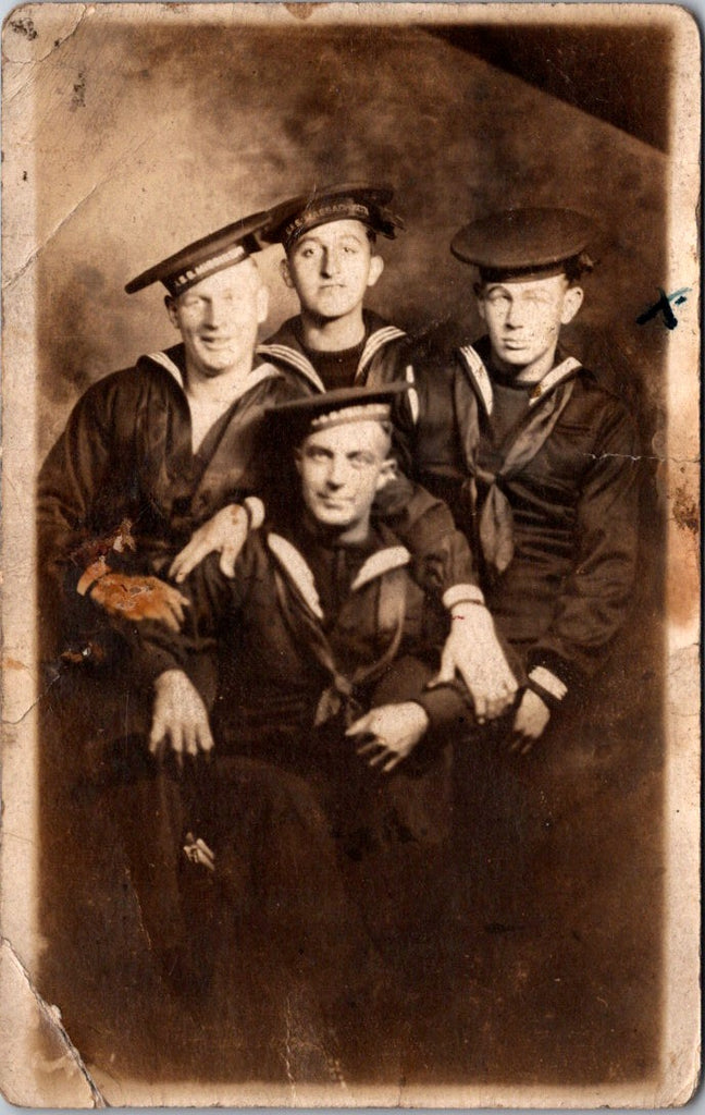 Military Men in uniform - USS Massachusetts on hat, 4 guys posing - RPPC