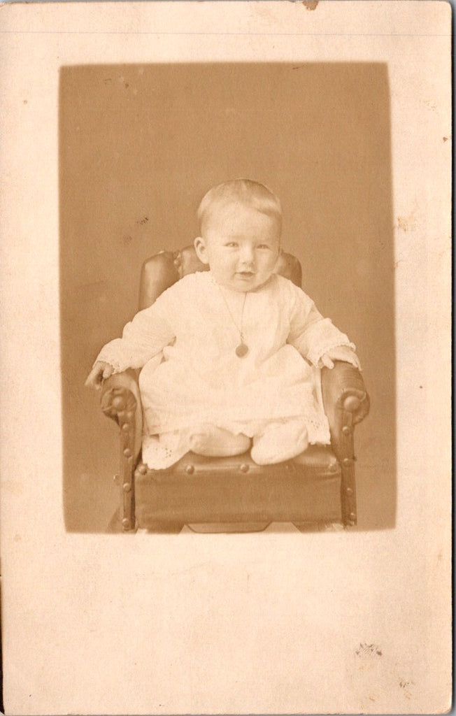 People - Child - sitting on mini stuffed chair with tacks - RPPC - E23245