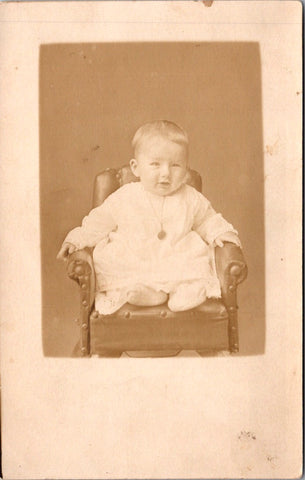 People - Child - sitting on mini stuffed chair with tacks - RPPC - E23245