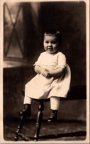People - Child - sitting, dressed in white with dark button boots - RPPC - E23247