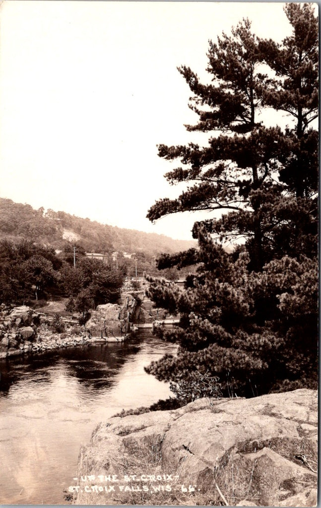 WI, ST CROIX FALLS - Bridge, buildings beyond water - RPPC postcard - E23481
