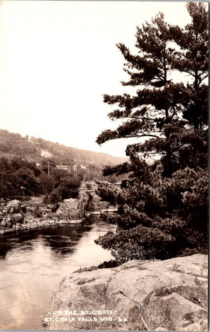 WI, St Croix Falls - Bridge, buildings beyond water - RPPC postcard - E23481