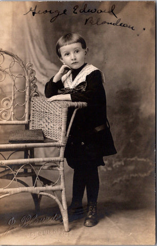 People - Boy - leaning on wicker chair - Plourde RPPC - F09140