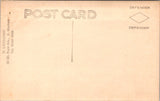 People - Child - sitting in a wicker chair, in knitted outfit - RPPC - F09148