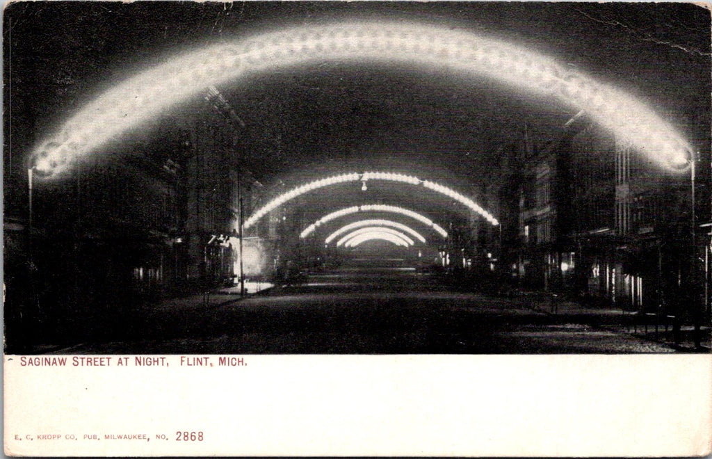 MI, FLINT - Saginaw St lit up at night postcard - K04088