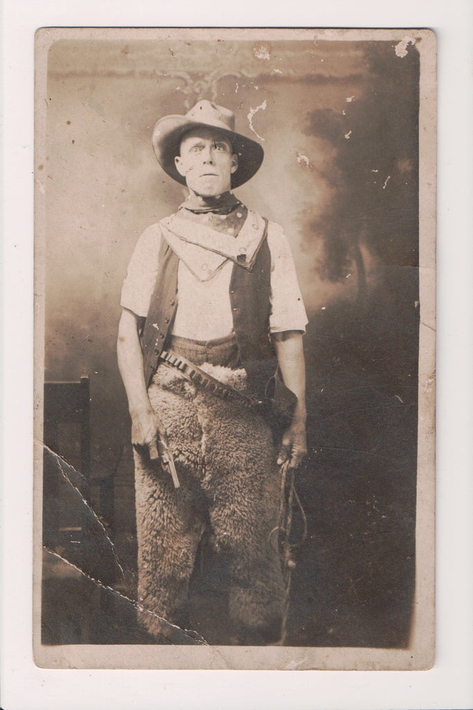 People - Man wearing fur chaps, gun holster, whip, pistol - RPPC - MB0327