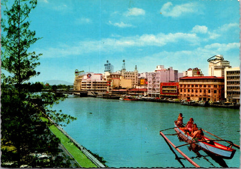 Foreign postcard - MANILA, Philippines - skyline over river, ladies on boat - NL