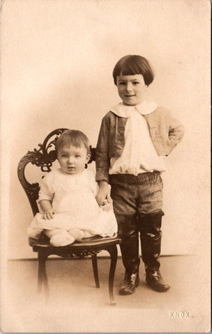 People - Children - posing, 1 in chair 1 standing in thigh boots - KNOX RPPC - NL0890