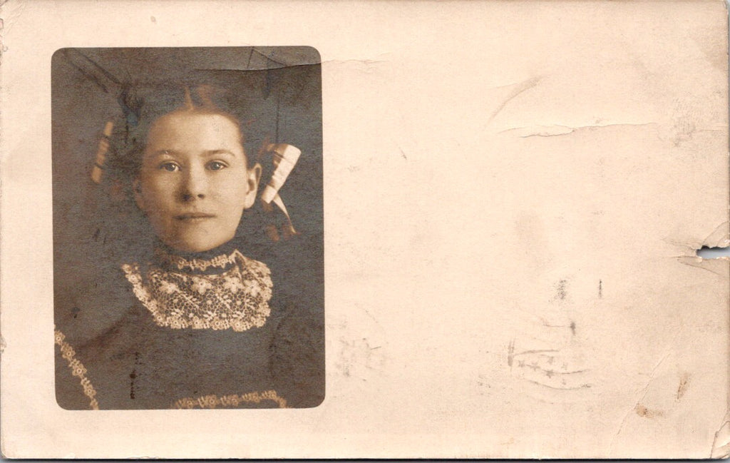 People - Girl - chest up view with lace around neck, hair in ribbon RPPC - NL0895