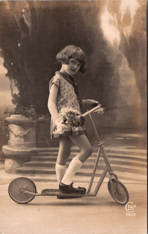 People - Girl - female child on a scooter in a studio RPPC - NL0896