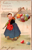 Greetings - Misc - Dutch girl carrying easter eggs, hanging from stick postcard