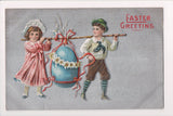 Easter postcard - boy and girl carrying large egg on stick - A19037