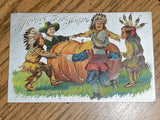 Thanksgiving - Pilgrim and indian kids holding hands around pumpkin - A19128