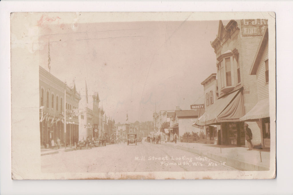WI, Plymouth - Mill St - signs: Stolper Bros, Variety, Shoes - RPPC - B06061