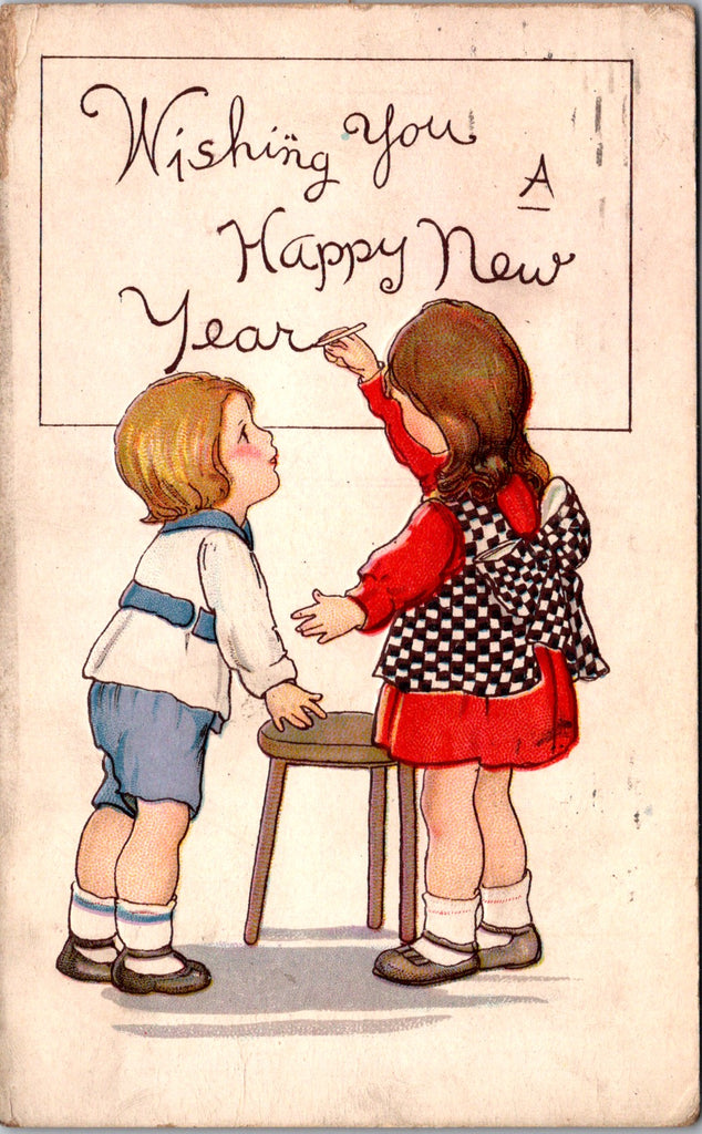 New Year - girl writing on board with another child along side - B17129