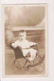 MISC - BABY strapped in to a wicker pull cart - RPPC - BP0071