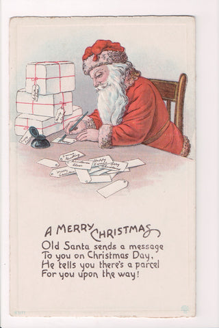 Xmas - Santa writing labels out with ink pen - vintage postcard - C06233