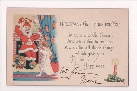 Xmas - kid with a robber mask on holding a gun to Santa Claus - C06739