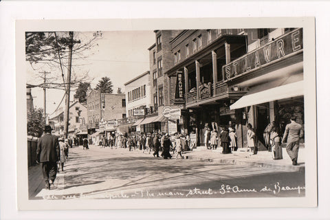 Canada - STE ANNE de BEAUPRE, QC - Man St, people, stores RPPC - F11060