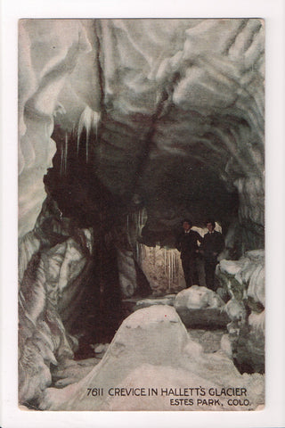 CO, ESTES PARK - Crevice in Halletts Glacier, men inside - B17043
