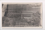Animal - Chicken / Hen in a crude cage with chicks in front - RPPC - E05011