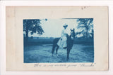 People - Female - Cyanotype - @1909 Real Photo Postcard of a lady with dress on pony - w04