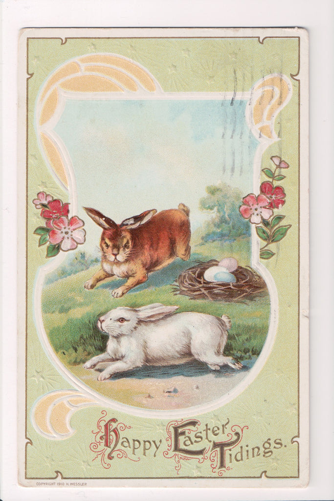 Easter - Brown and White bunny rabbits near eggs on nest - A17370