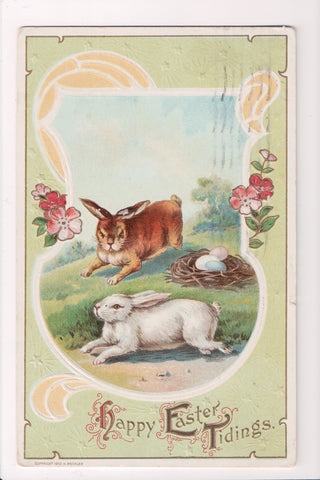 Easter - Brown and White bunny rabbits near eggs on nest - A17370