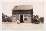 NE, NEBRASKA CITY - John Brown Cave, Cabin, Man in chair - RPPC - G17220