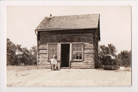 NE, NEBRASKA CITY - John Brown Cave, Cabin, Man in chair - RPPC - G17220
