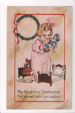 Xmas - Christmas - Girl about to put her baby doll to bed - C08599