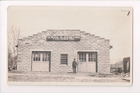 IA, Maurice - Taeke Stellingwerf Blacksmith in front of his Shop RPPC - K06130