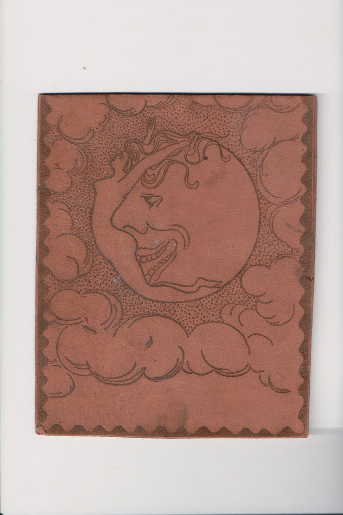 Fantasy - Nude woman laying on moon face, with flowing hair - leather - C17905