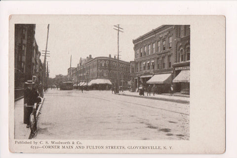 NY, GLOVERSVILLE - Main and Fulton Sts - Millers (store), man on bike - MB0716